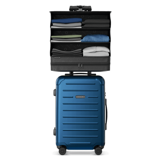 Front view of the blue Carry-On Closet Lite suitcase, size Medium, with closet system