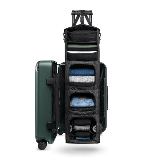 Medium Carry-On Closet Original luggage in jade green — open closet view showing organized interior
