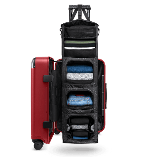 Medium Carry-On Closet Original luggage in red — open closet view showing organized interior