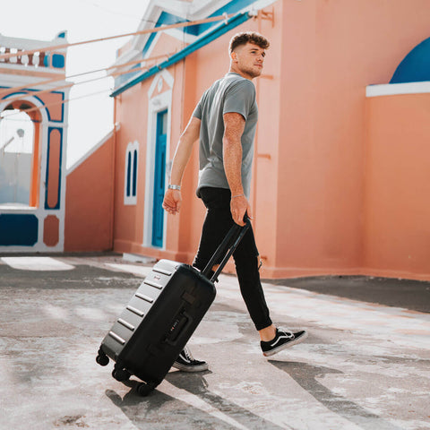 Colin Ringas with Black Carry-On Closet luggage