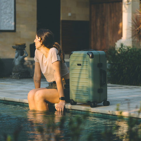 Loren Sanchez with Green Carry-On Closet luggage