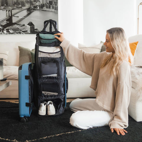 Karina Weber with Blue Carry-On Closet luggage